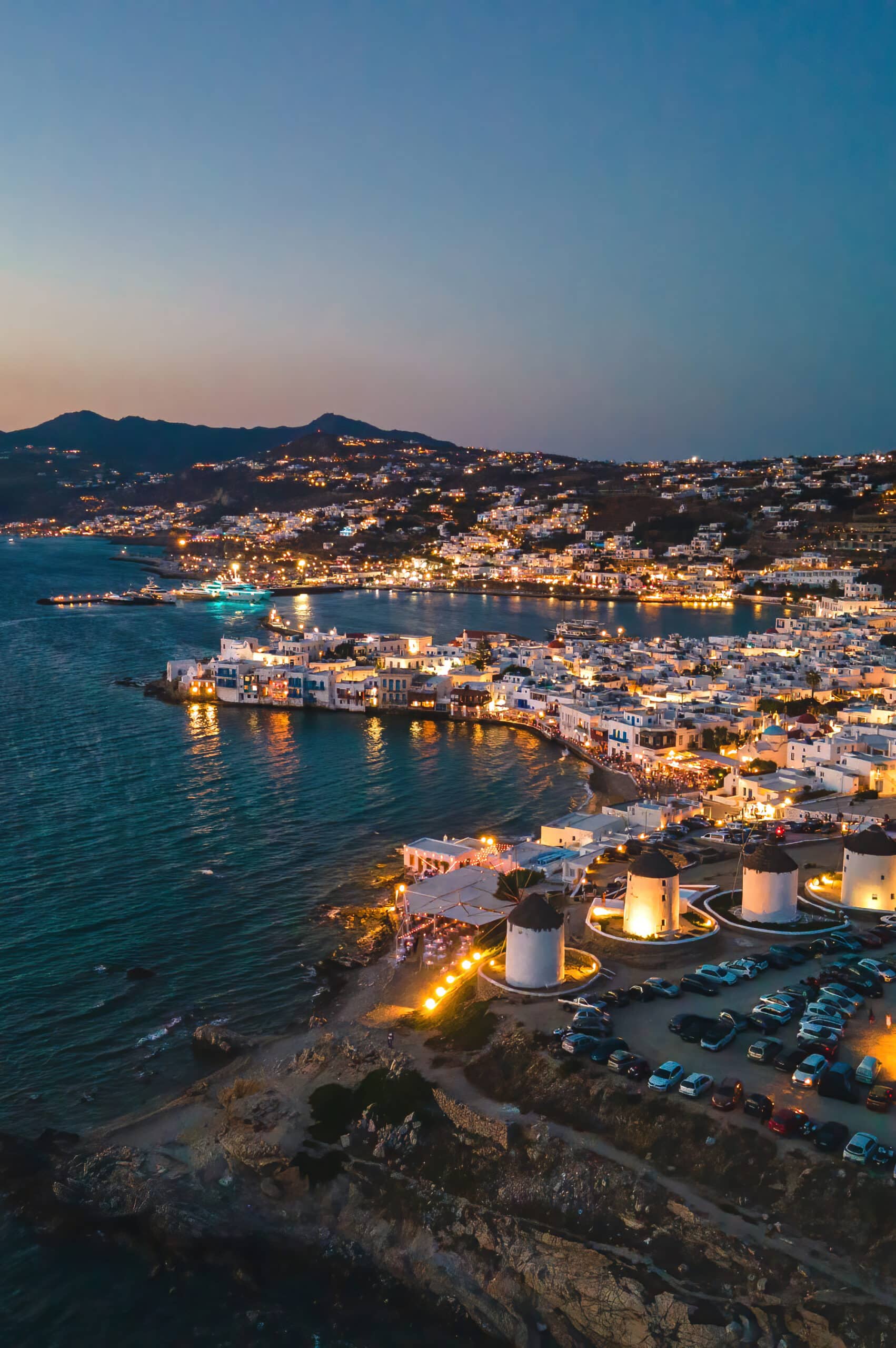 aerial-sunset-view-of-mykonos-old-town-and-port-2025-09-29-17-37-13-utc