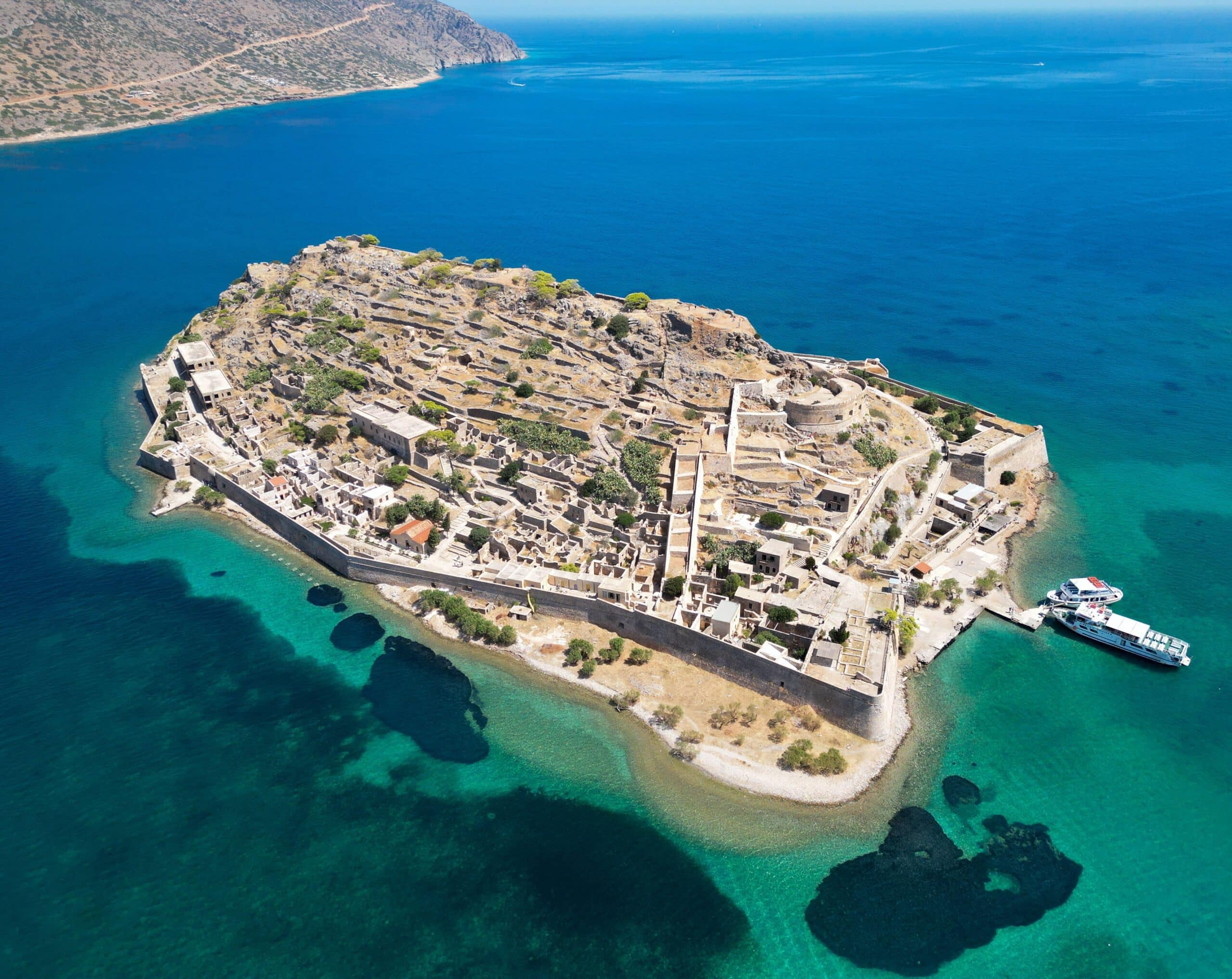 An aerial view of the fortress on the island of Spinalonga with calm sea