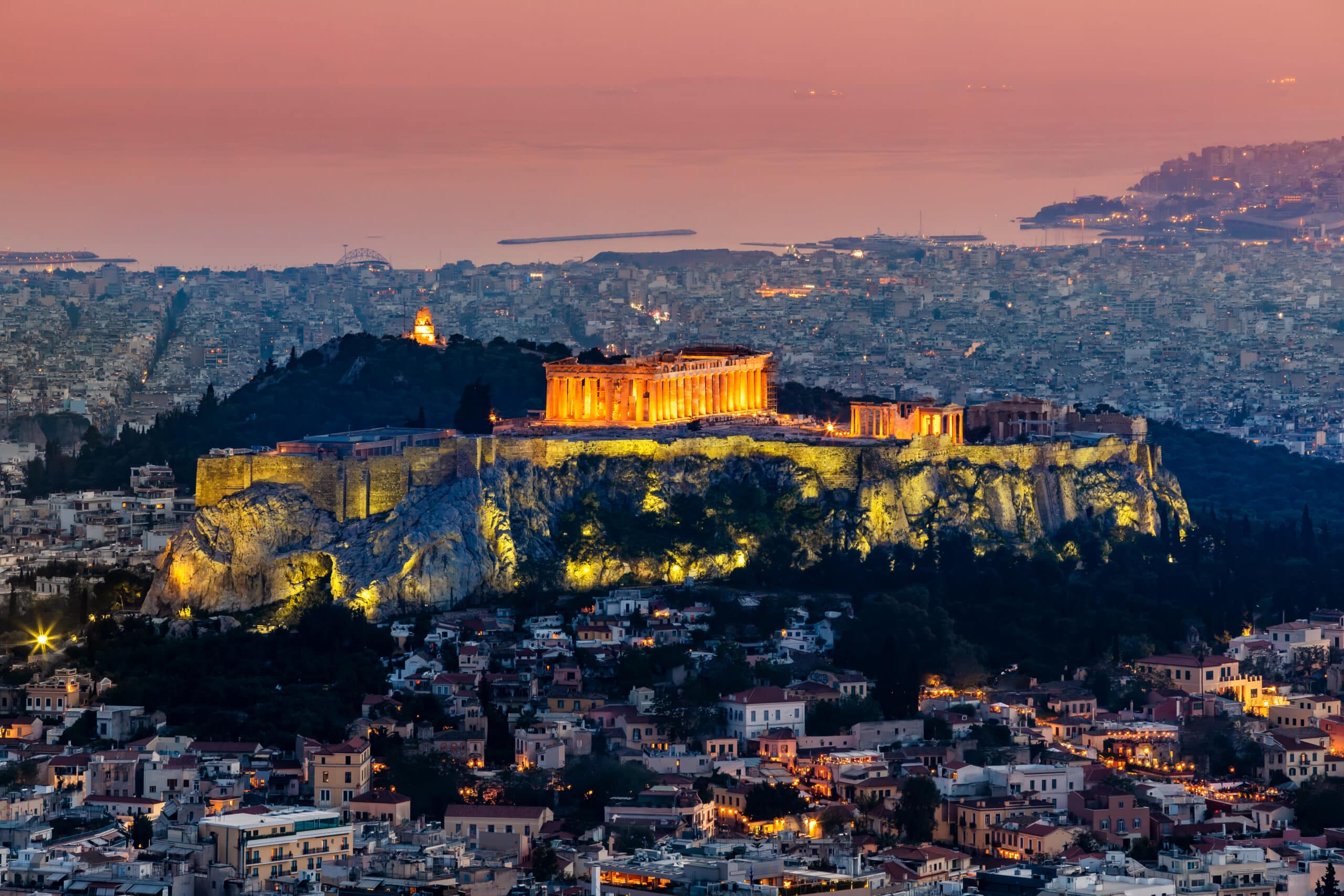 Scenic panoramic view on Acropolis in Athens, Greece at sunrise. Colourful travel background with dramatic sky